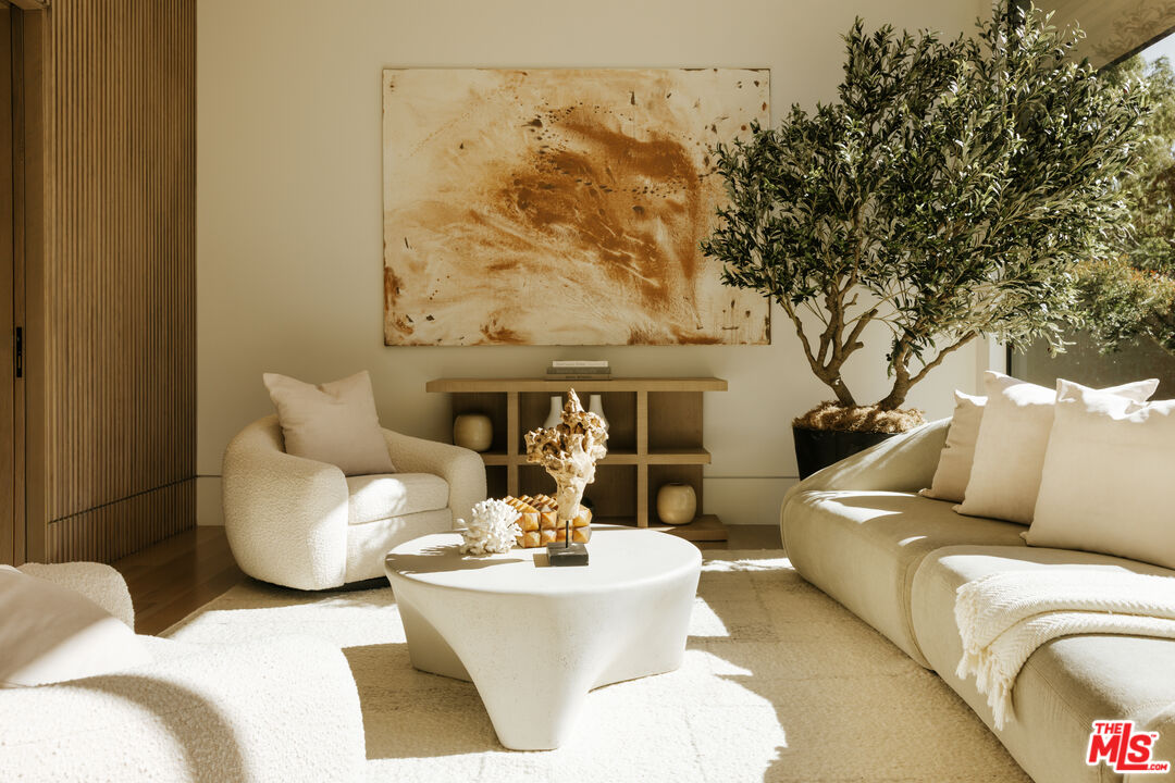 219 Homewood Road Los Angeles, CA 90049 - Photo 15 of 40 a living room with furniture and a fireplace