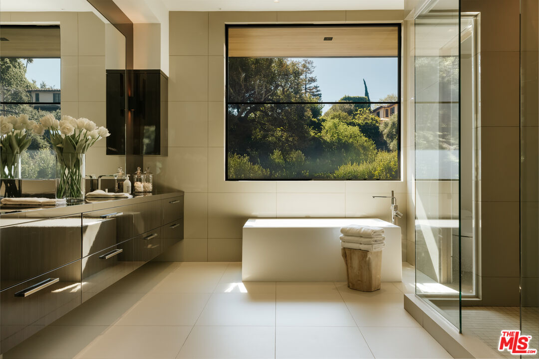 219 Homewood Road Los Angeles, CA 90049 - Photo 18 of 40 a bathroom with a sink and a mirror
