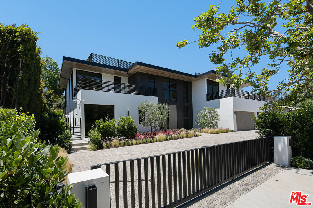 219 Homewood Road Los Angeles, CA 90049 - Photo 2 of 40 a front view of a house with yard