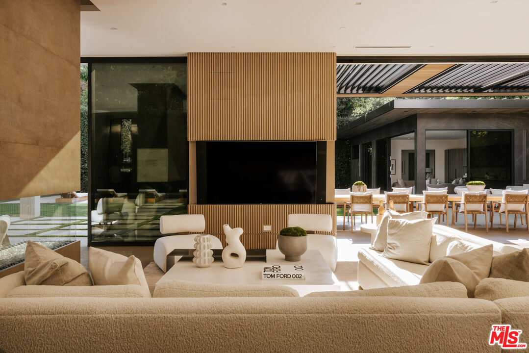 219 Homewood Road Los Angeles, CA 90049 - Photo 25 of 40 a living room with furniture and a fireplace