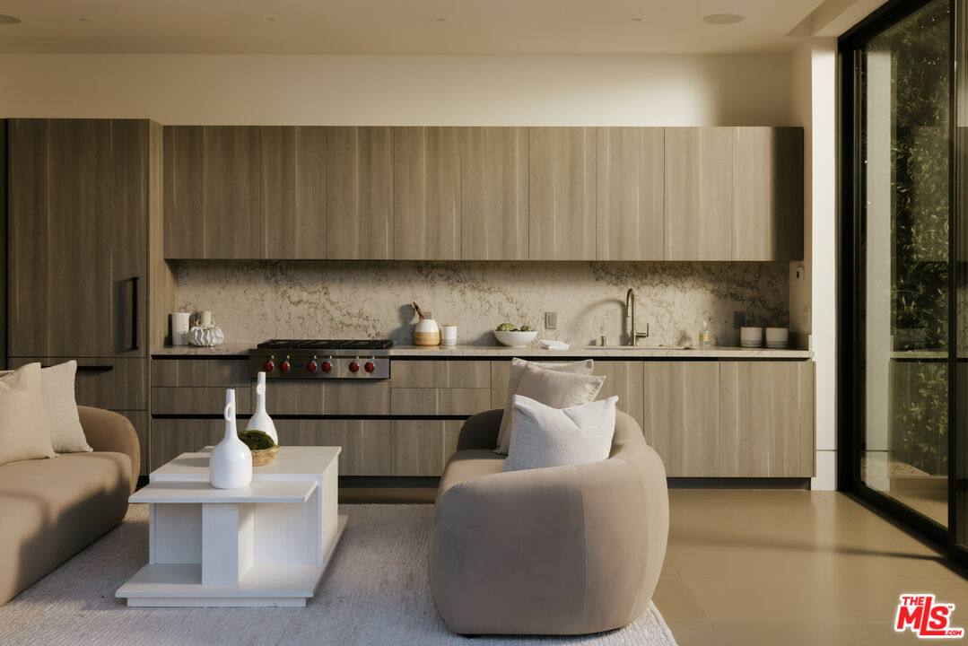 219 Homewood Road Los Angeles, CA 90049 - Photo 27 of 40 a kitchen with a sink a refrigerator and window
