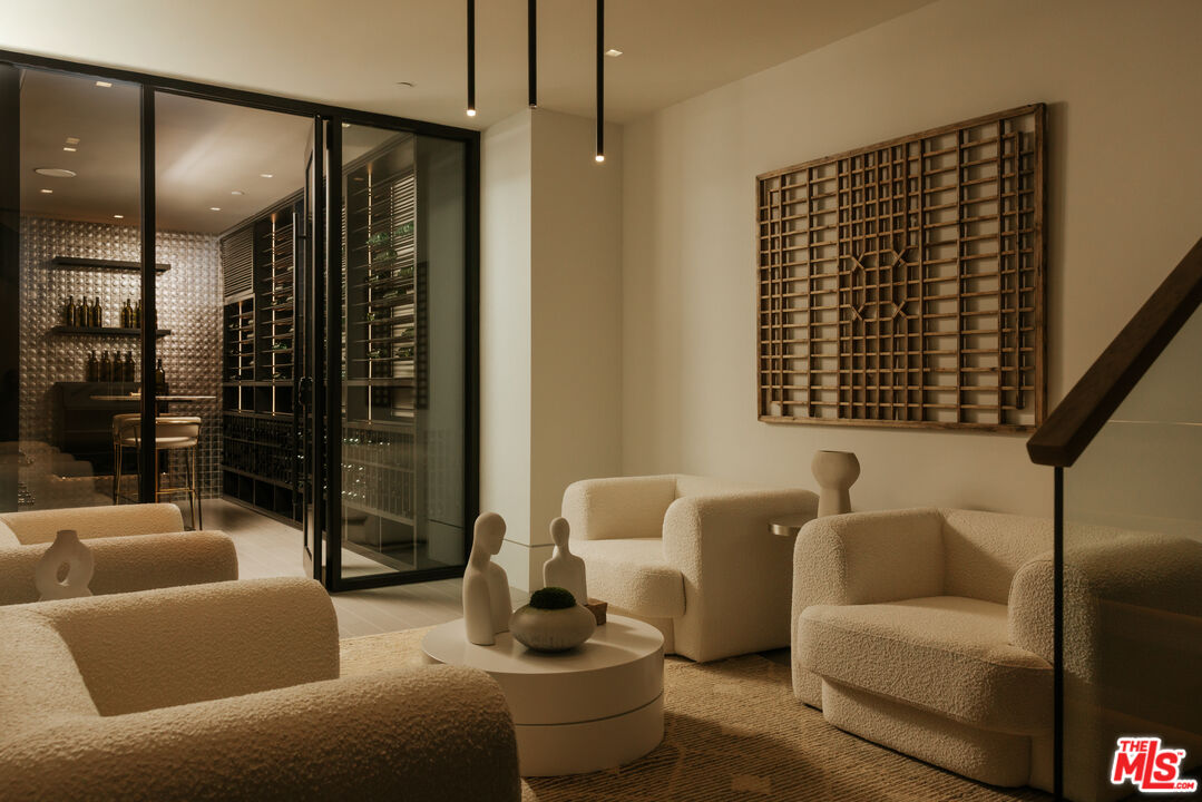 219 Homewood Road Los Angeles, CA 90049 - Photo 31 of 40 a living room with furniture and a floor to ceiling window