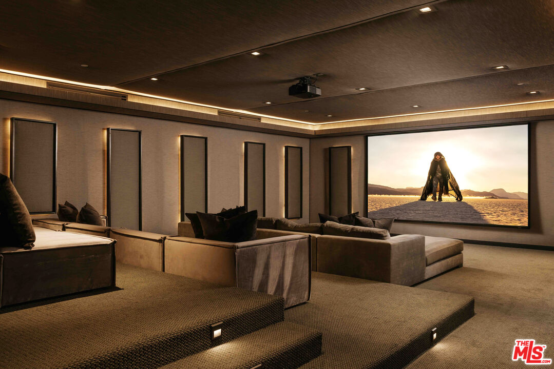 219 Homewood Road Los Angeles, CA 90049 - Photo 32 of 40 a kitchen with stainless steel appliances granite countertop a sink and a refrigerator