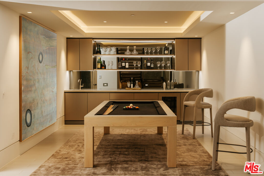 219 Homewood Road Los Angeles, CA 90049 - Photo 33 of 40 a kitchen with a sink cabinets and appliances