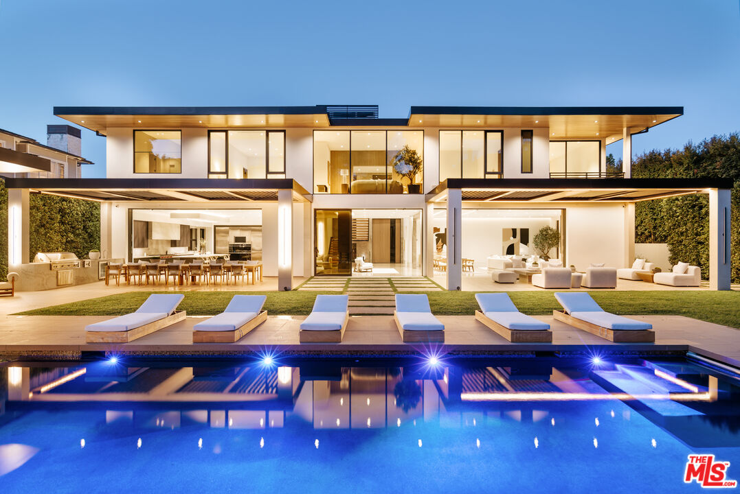 219 Homewood Road Los Angeles, CA 90049 - Photo 36 of 40 a living room filled with furniture and a floor to ceiling window