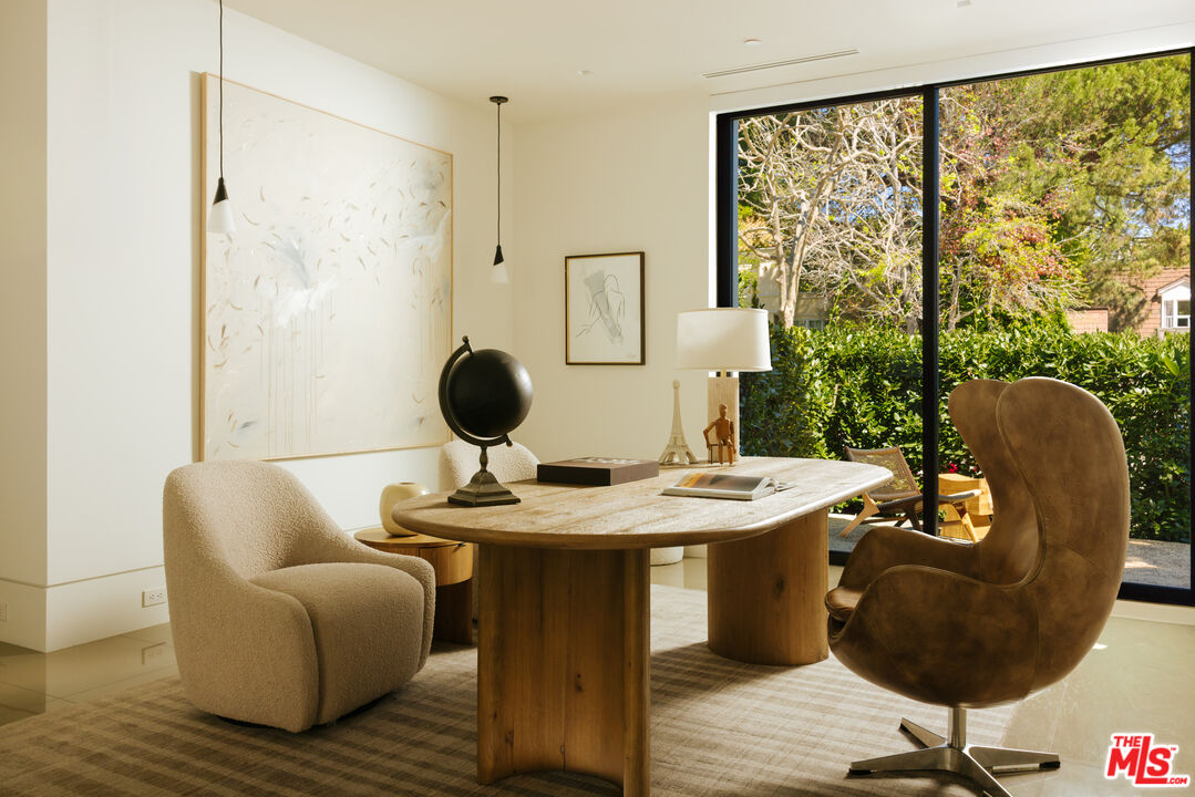 219 Homewood Road Los Angeles, CA 90049 - Photo 8 of 40 a dining room with furniture and wooden floor