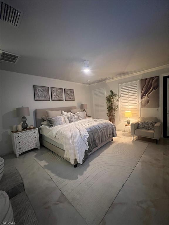9081 Albion Lane South, Unit 6510 Naples, FL 34113 - Photo 17 of 31 a bedroom with a bed and a couch