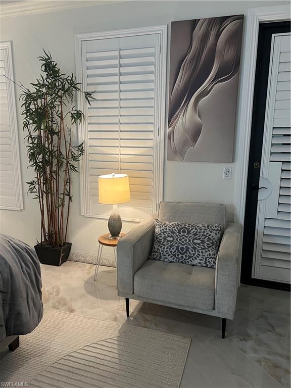 9081 Albion Lane South, Unit 6510 Naples, FL 34113 - Photo 18 of 31 a living room with furniture and a potted plant