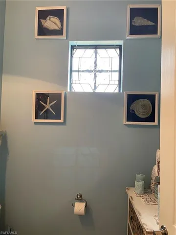 a view of a room with large windows