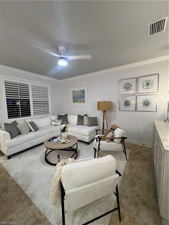 9081 Albion Lane South, Unit 6510 Naples, FL 34113 - Photo 3 of 31 a living room with furniture and a large window