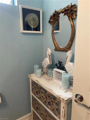 a dining room with furniture a rug and a chandelier