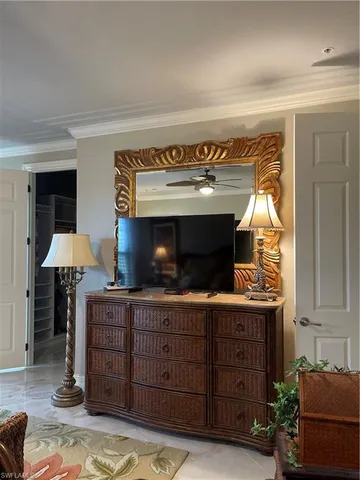 a white toilet sitting next to a bath tub and a shower