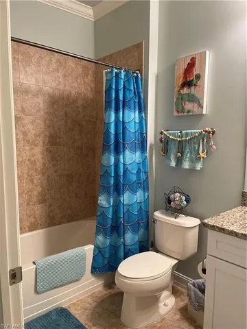 a bed room with a bed and a chandelier