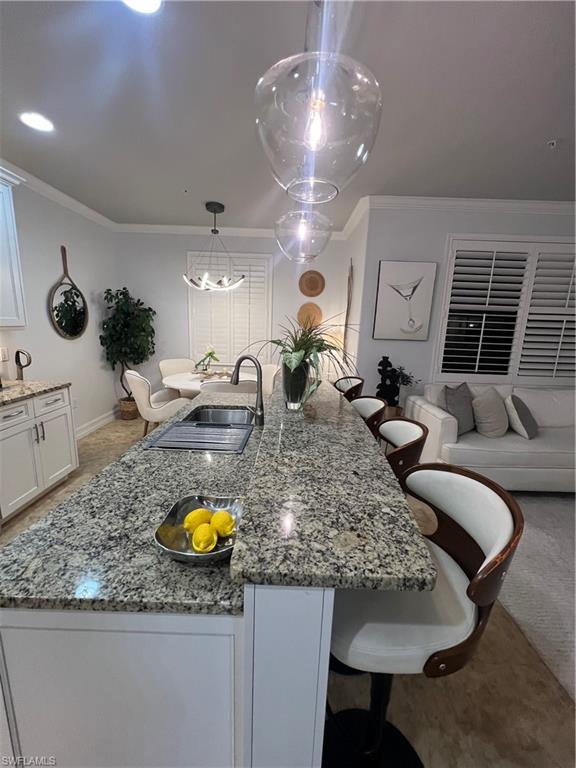 9081 Albion Lane South, Unit 6510 Naples, FL 34113 - Photo 5 of 31 a kitchen with sink and refrigerator