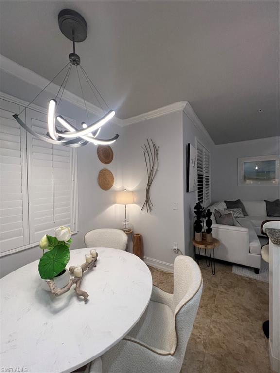 9081 Albion Lane South, Unit 6510 Naples, FL 34113 - Photo 7 of 31 a living room with furniture and a chandelier