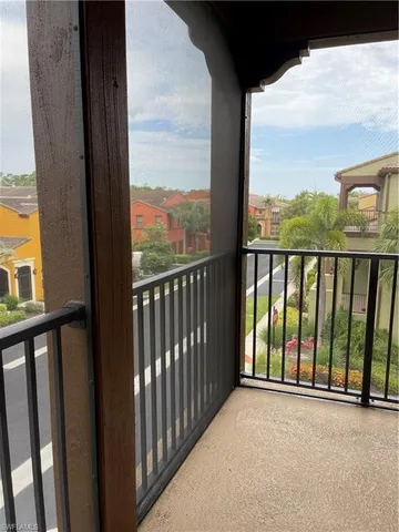 a kitchen with stainless steel appliances kitchen island granite countertop a table chairs and a refrigerator