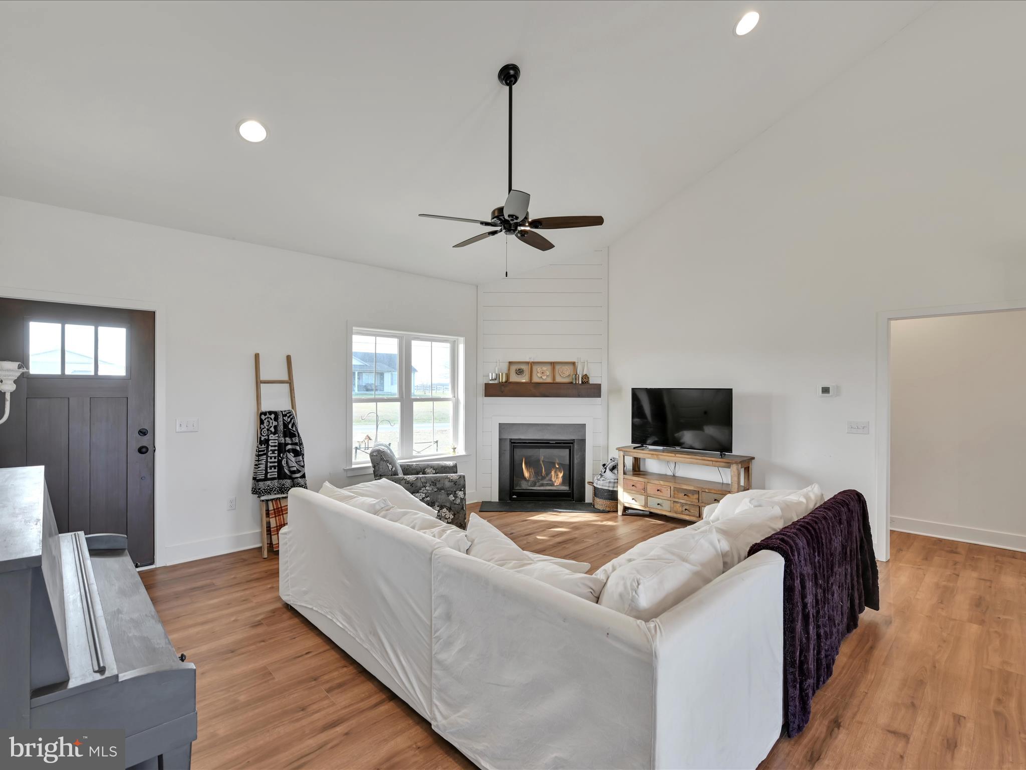 2 Fairmount Road Kirkwood, PA 17536 - Photo 6 of 42 a living room with furniture a fireplace and a flat screen tv