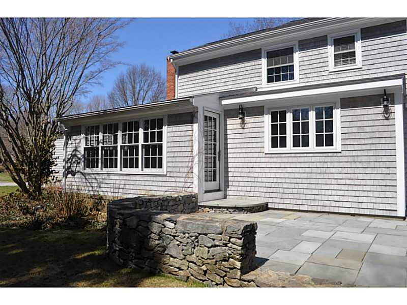 15 Ridgewood Road Barrington, RI 02806 - Photo 2 of 22 Exterior Back. New stone patio is accessed from either the dining area or living room, and features a distinctive stone wall.