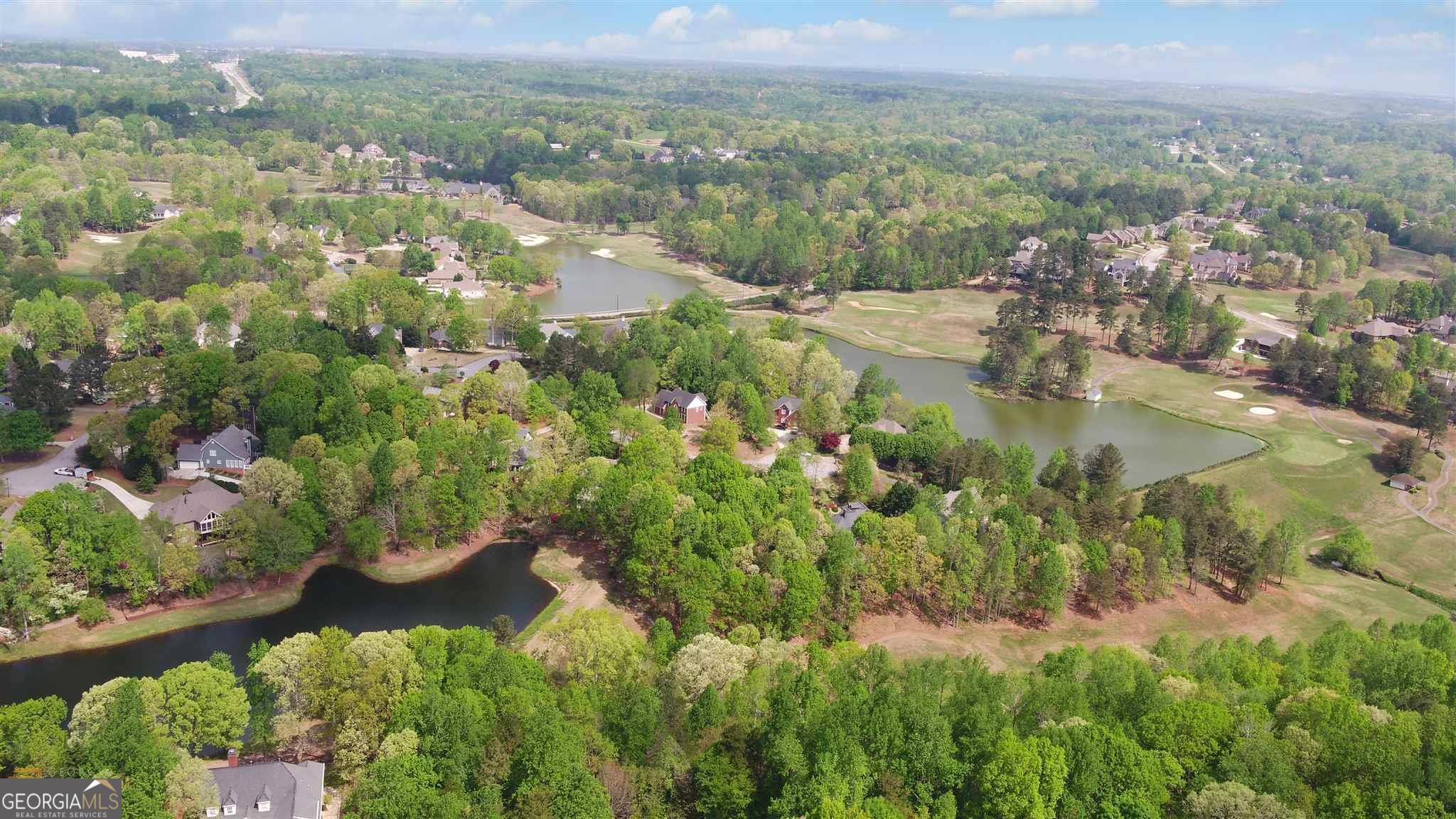 4835 Upper Berkshire Road Flowery Branch, GA 30542 - Photo 7 of 16 an aerial view of residential house with outdoor space and trees all around