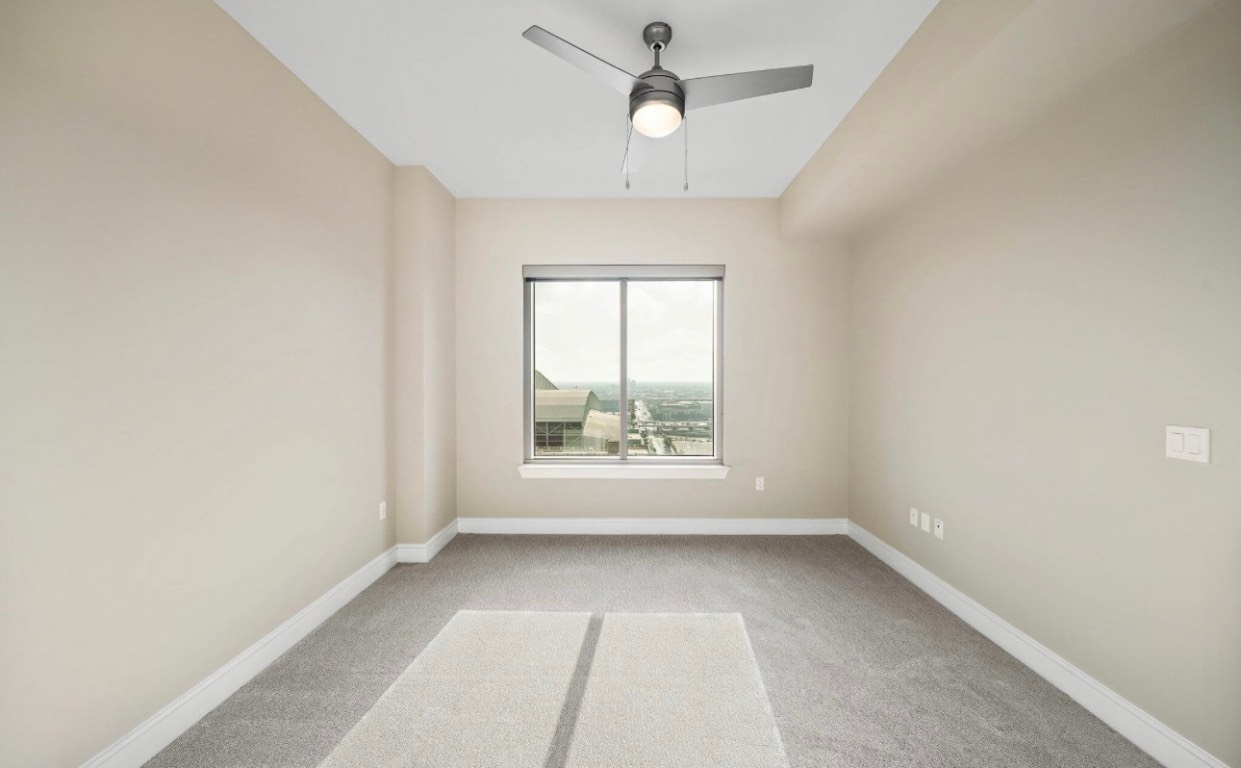 1475 Texas Street, Unit 415 Houston, TX 77002 - Photo 7 of 11 an empty room with a window