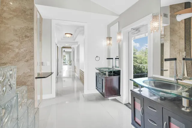 a kitchen with a sink and refrigerator