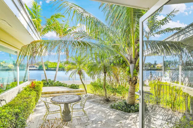 a view of swimming pool with a table and chairs