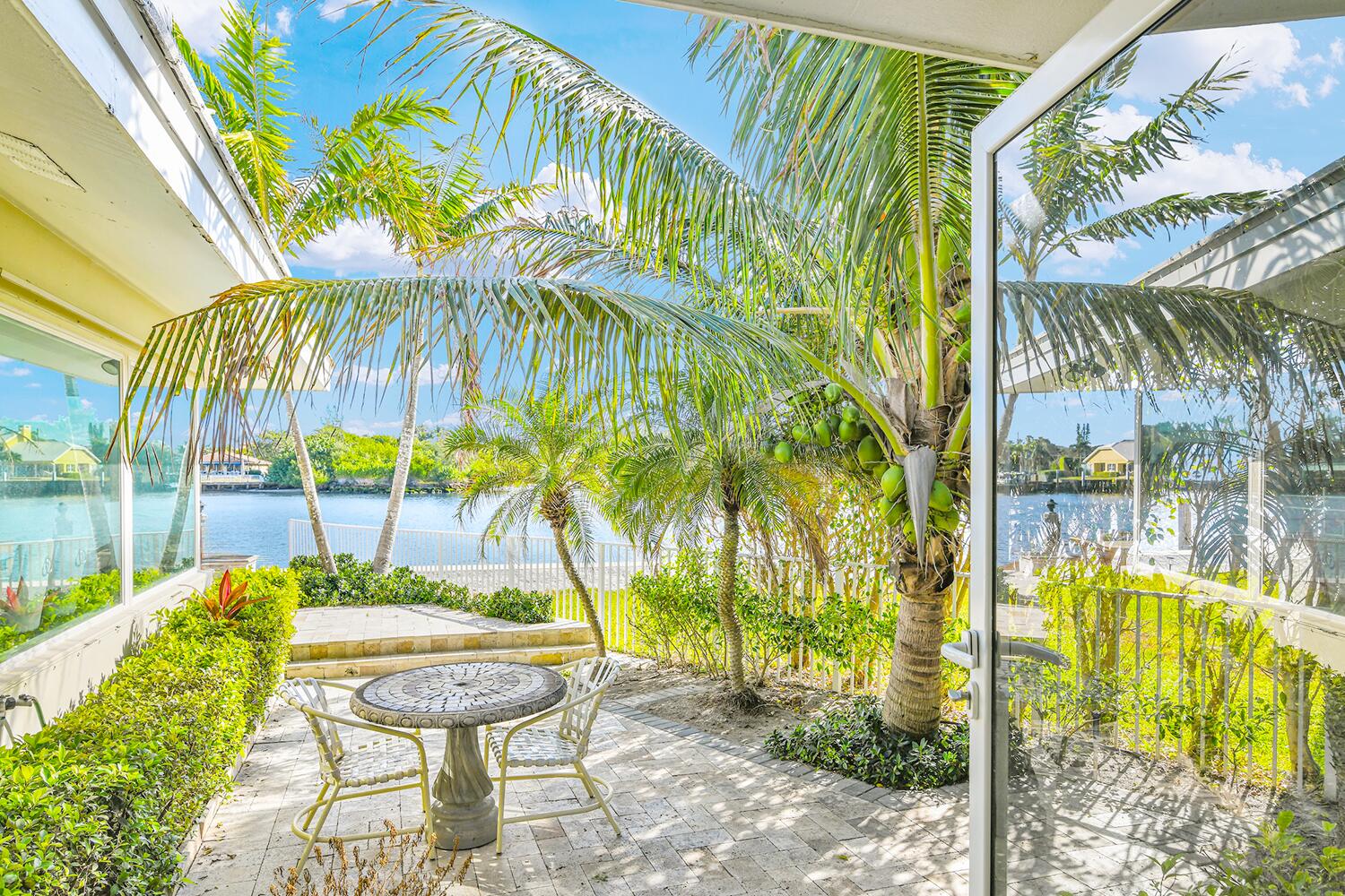 655 Castilla Lane Boynton Beach, FL 33435 - Photo 19 of 23 a view of swimming pool with a table and chairs