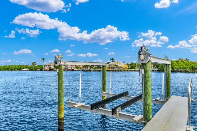 a view of a terrace with a table and chairs