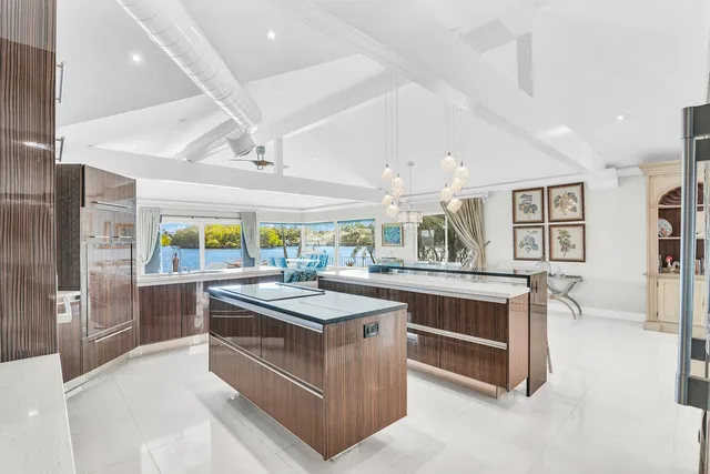 a kitchen with stainless steel appliances a stove and cabinets