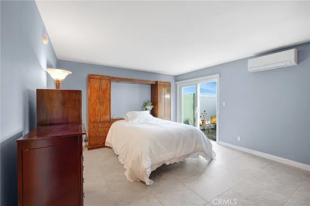 a bedroom with a bed and dresser