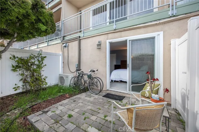 a view of a swimming pool with outdoor seating