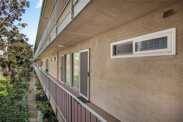 a kitchen with kitchen island a dining table and chairs