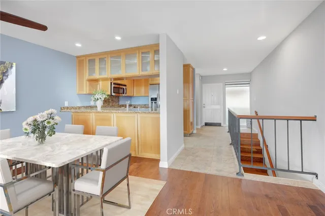 a kitchen with granite countertop a sink and cabinets
