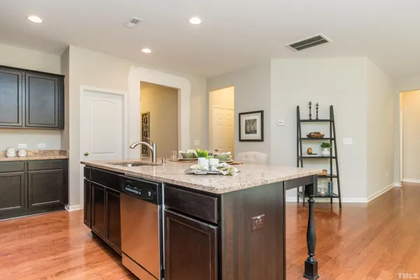 a kitchen with a sink and cabinets