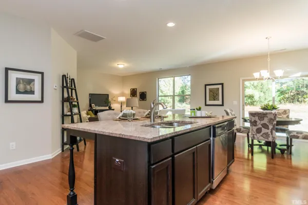 a kitchen with center island table and chairs in it
