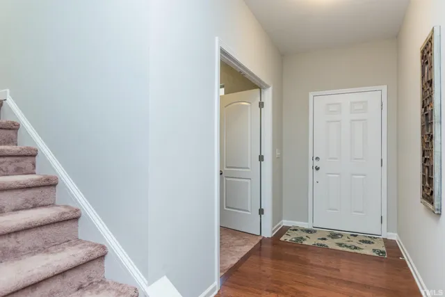 a view of an entryway with wooden floor