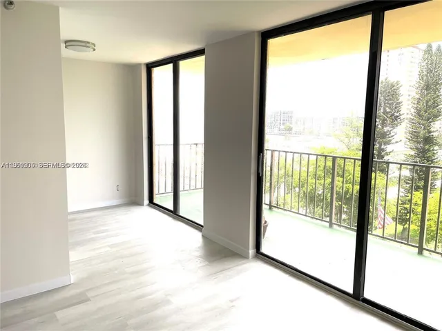 a view of a room with a large window