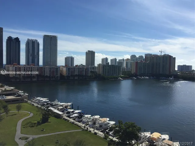 a lobby with furniture and a floor to ceiling window