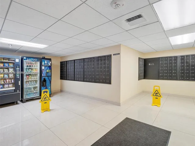 an aerial view of a house with a garden and lake view