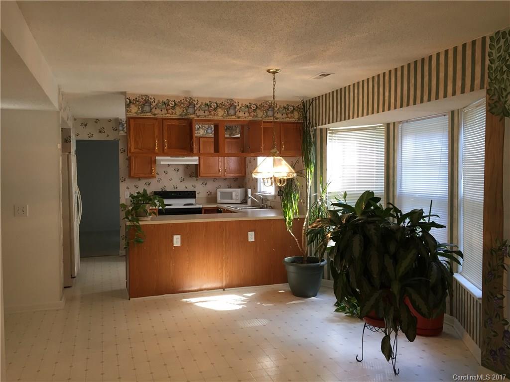 2224 Pimpernel Road Charlotte, NC 28213 - Photo 2 of 6 a room with gym equipment and a large window