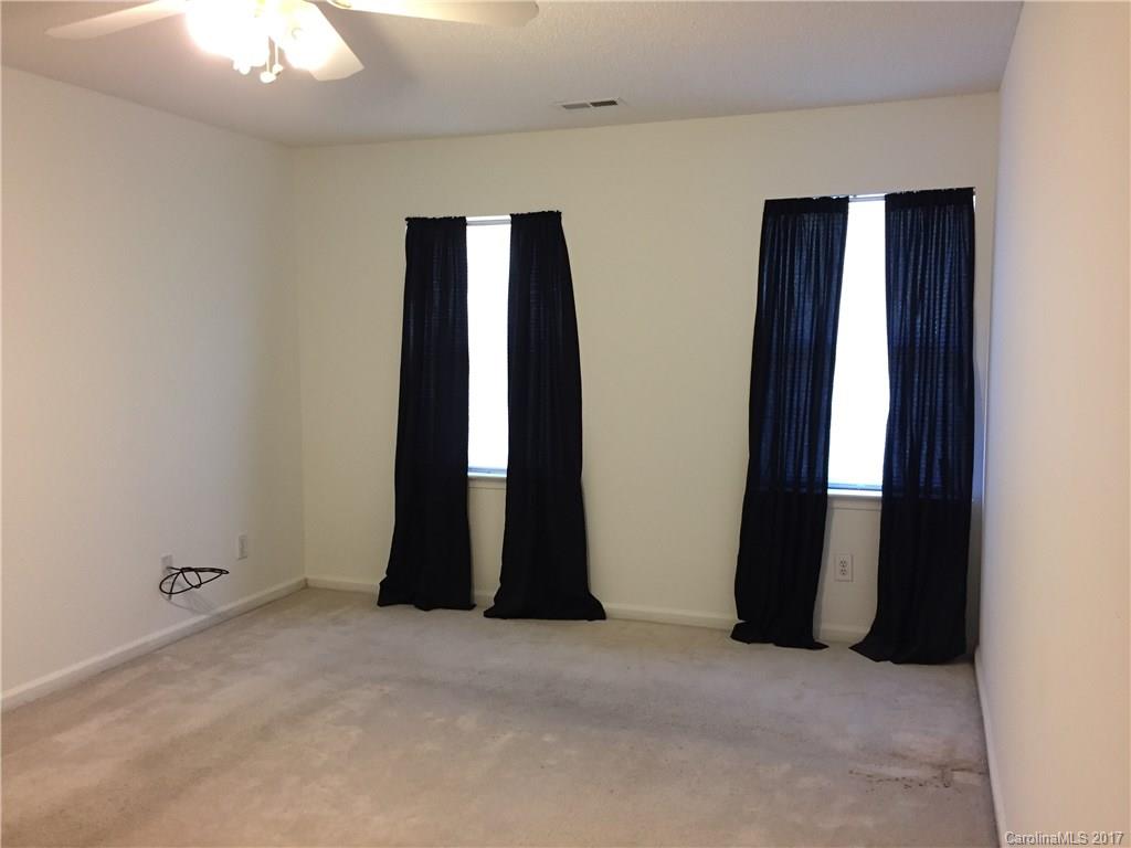 2224 Pimpernel Road Charlotte, NC 28213 - Photo 5 of 6 an empty room with windows and closet