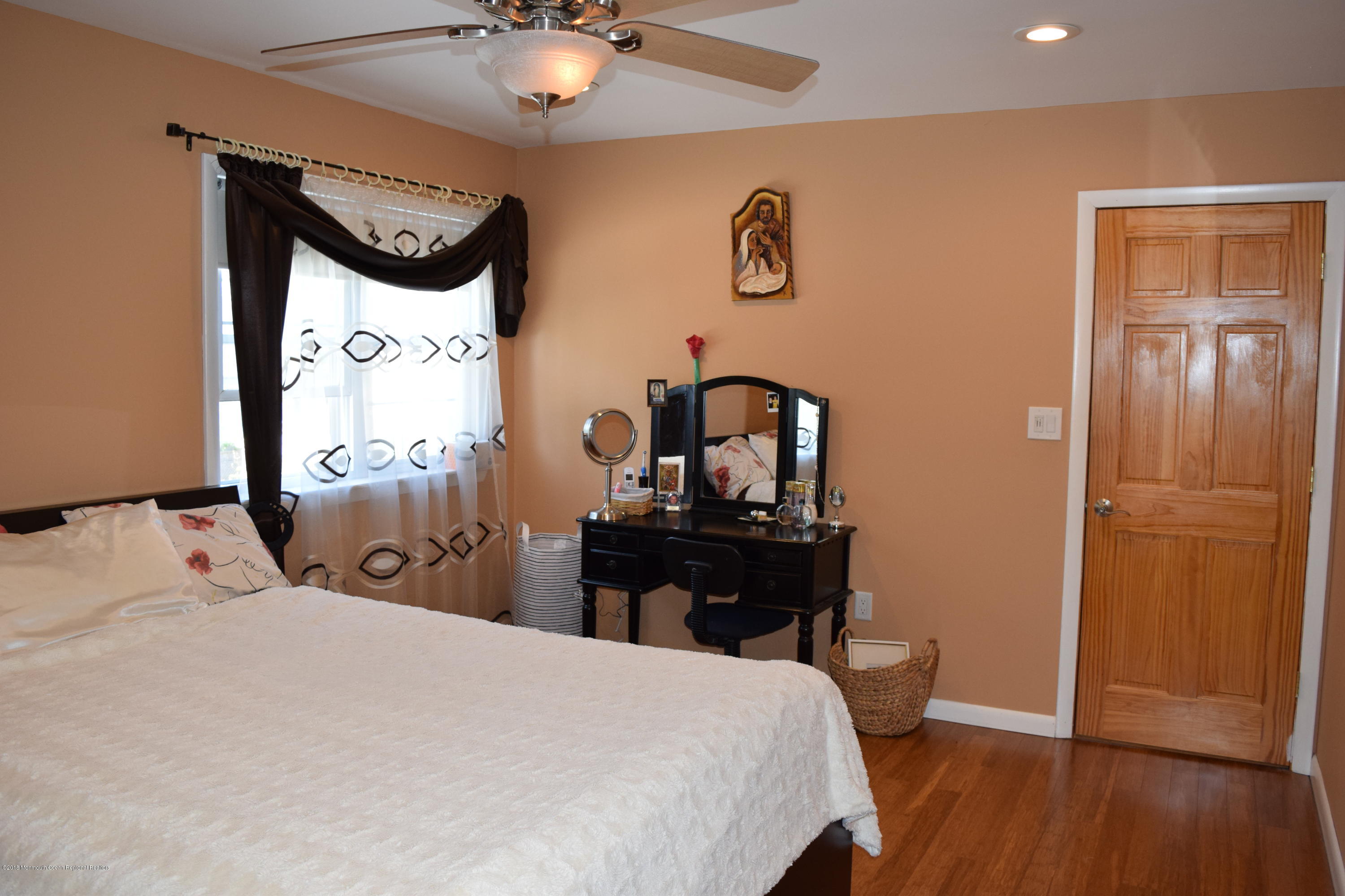 480 Adamston Road Brick, NJ 08723 - Photo 12 of 20 a bedroom with a bed and a table in it