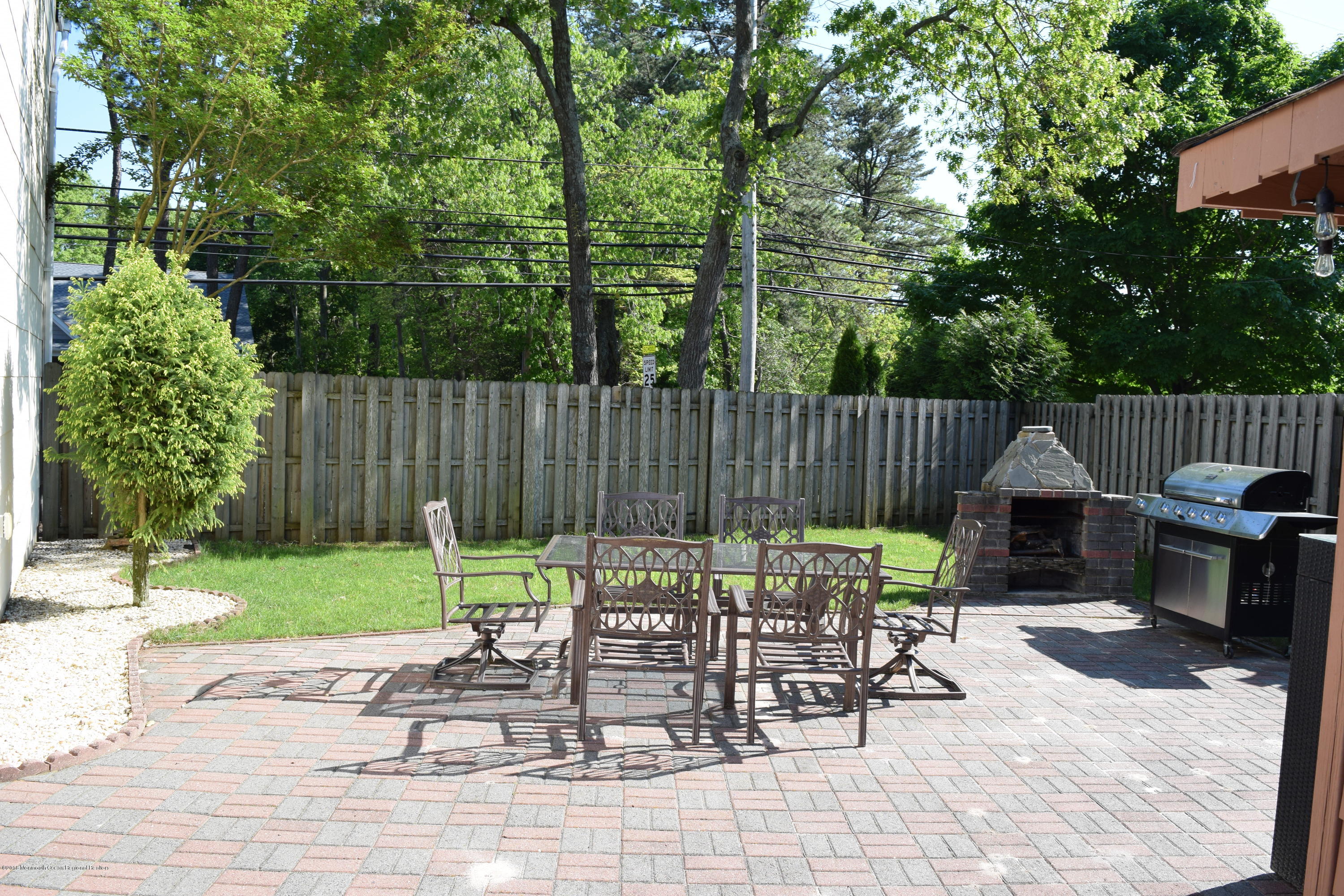 480 Adamston Road Brick, NJ 08723 - Photo 18 of 20 a view of backyard with a patio and outdoor seating