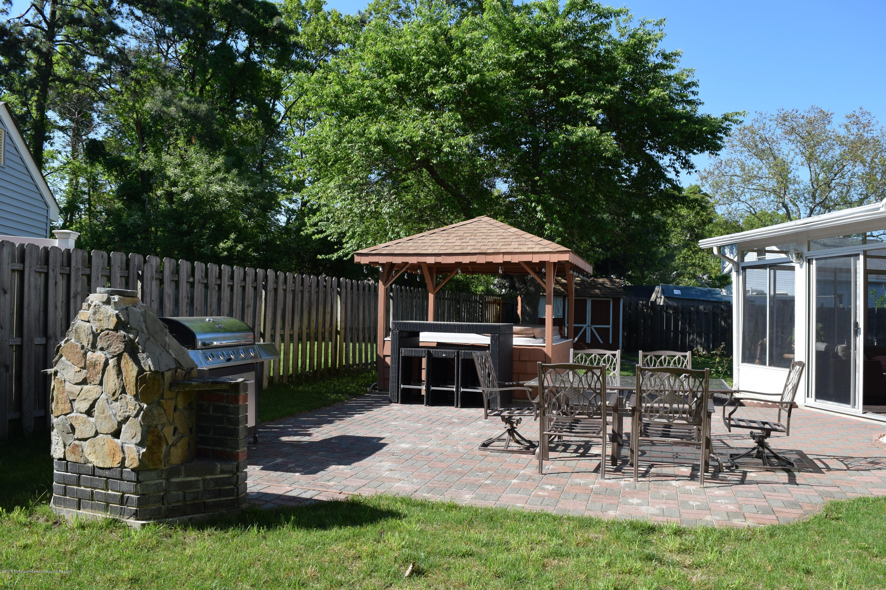 480 Adamston Road Brick, NJ 08723 - Photo 19 of 20 a view of table and chairs under an umbrella