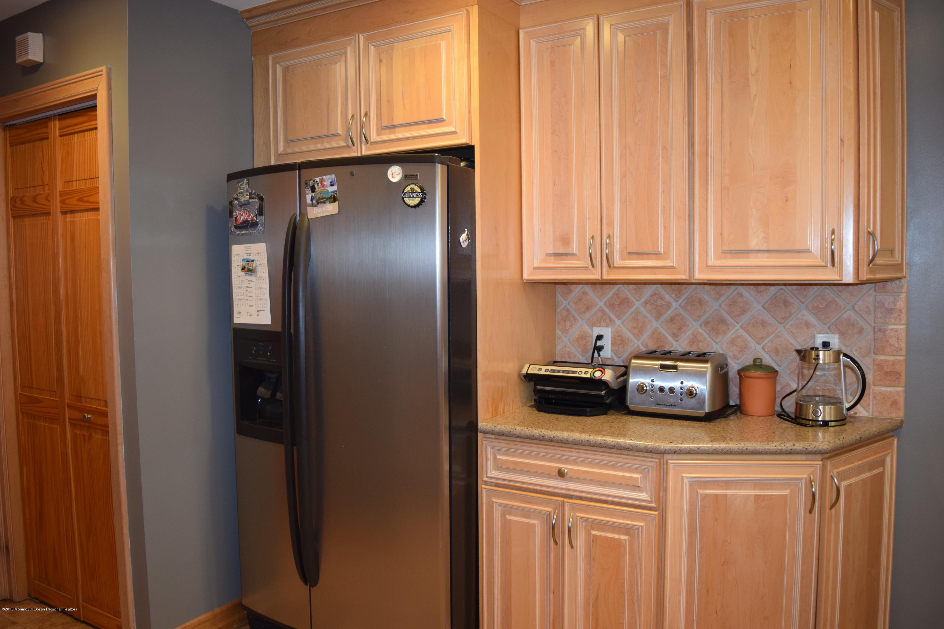 480 Adamston Road Brick, NJ 08723 - Photo 8 of 20 a kitchen with a refrigerator and cabinets