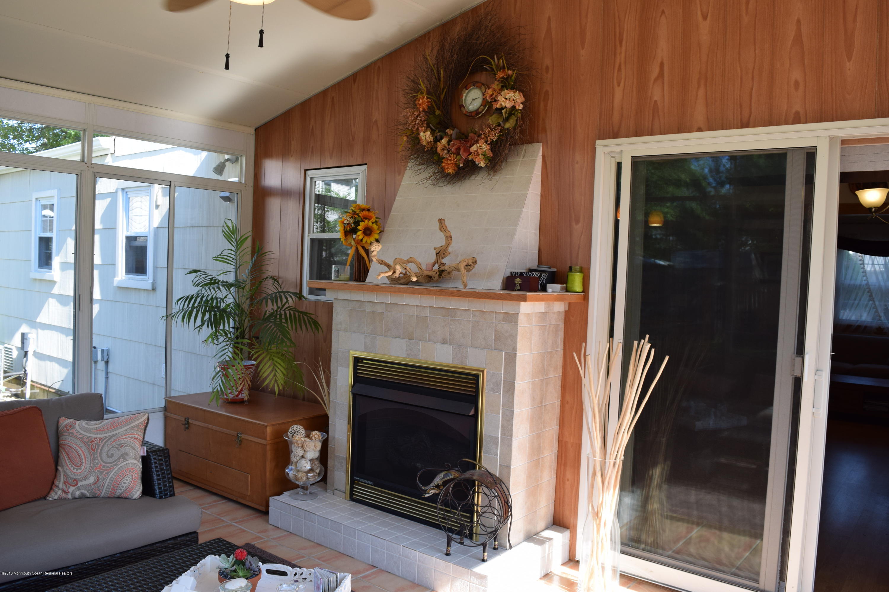 480 Adamston Road Brick, NJ 08723 - Photo 10 of 20 a living room with furniture and a fireplace