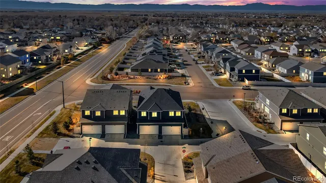 an aerial view of a house with a city view