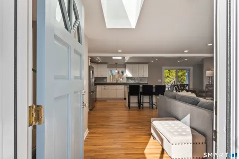 a lobby with furniture and a view of kitchen