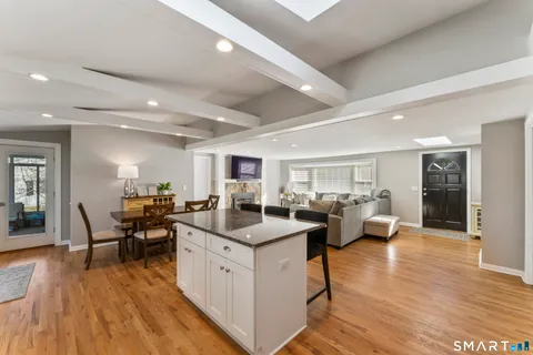 a open kitchen with sink and cabinets