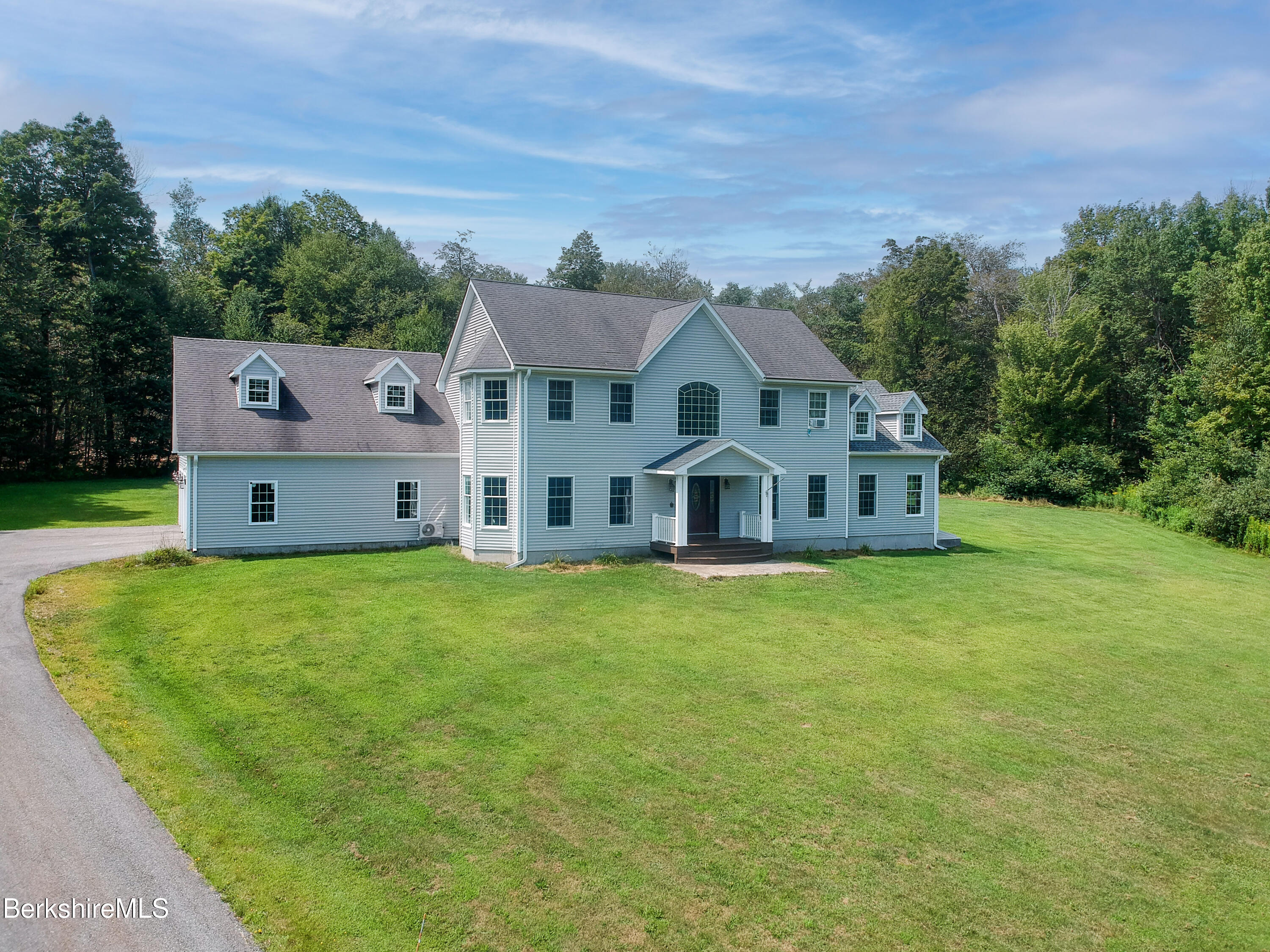155 High St Hill Road Windsor, MA 01270 - Photo 1 of 26 a front view of a house with a garden and yard